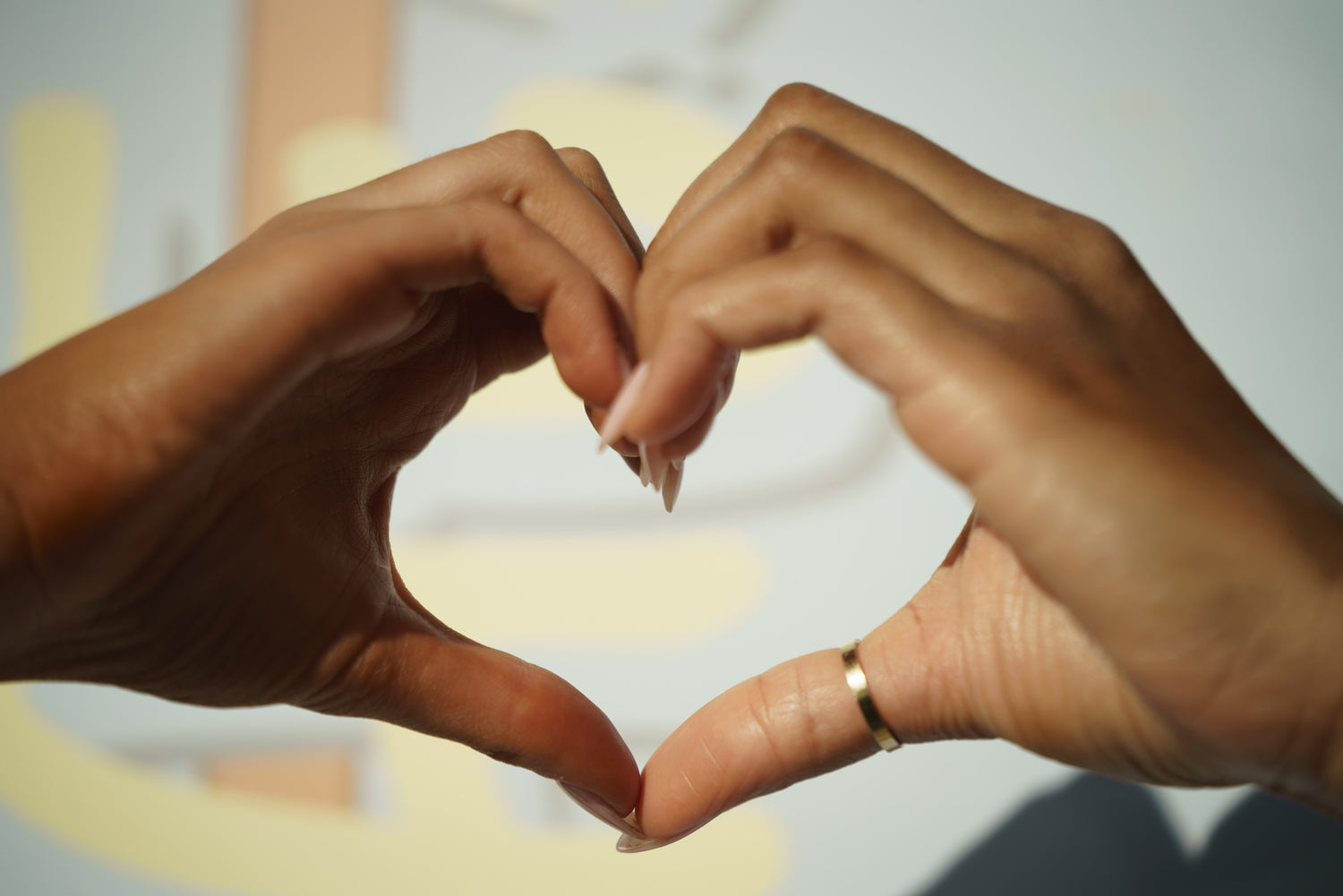 Sunnee BAEskin Hands forming a heart shape